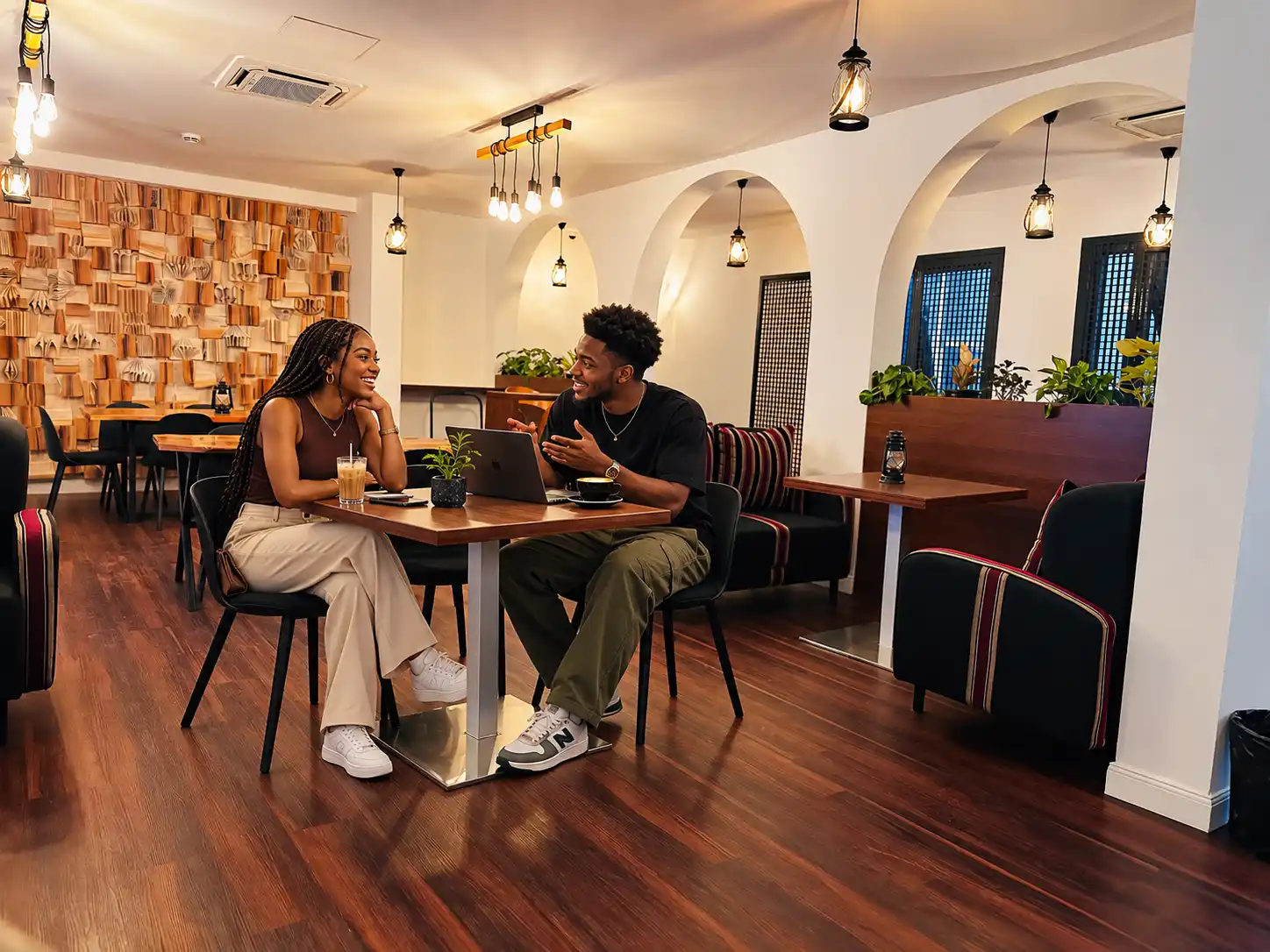 Gen Z guide to Lagos, Young man and woman enjoying a cafe outing in Lagos Nigeria,